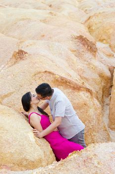 Asian couple hugging with canyon background. Valentine's day concept