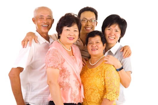 Indoor portrait of beautiful asian family over white background