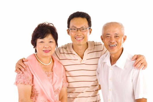 Indoor portrait of beautiful asian family over white background