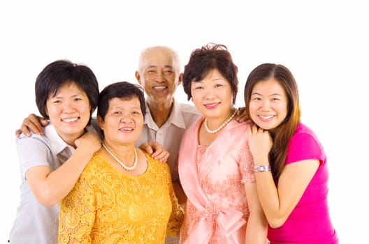 Indoor portrait of beautiful asian family over white background