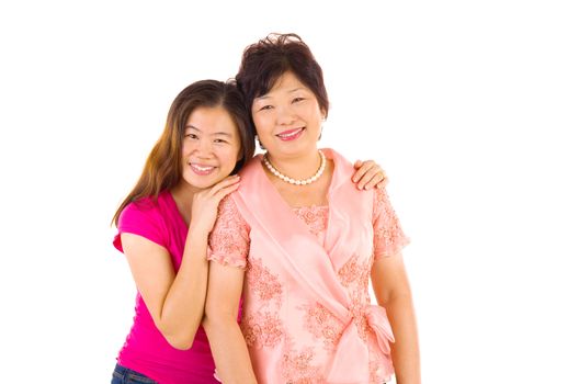 Asian mother and daughter. Happy Asian family mother and adult offspring having fun time at indoor studio.