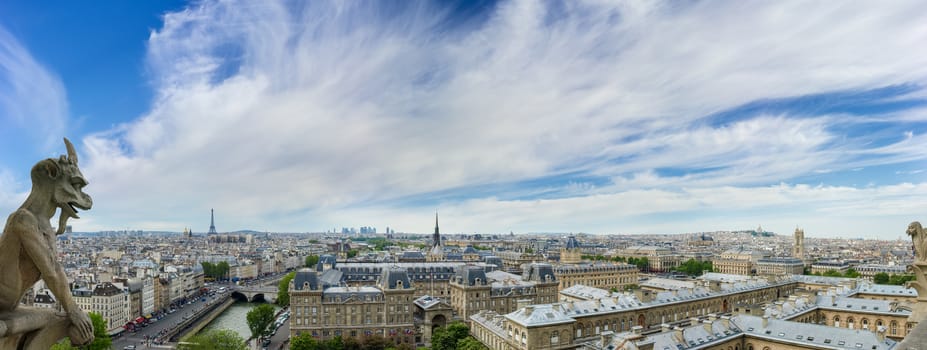 Panorama of northwestern part of Paris from the tower of the Cathedral Notre-Dame de Paris the background of sky with clouds in the springtime
