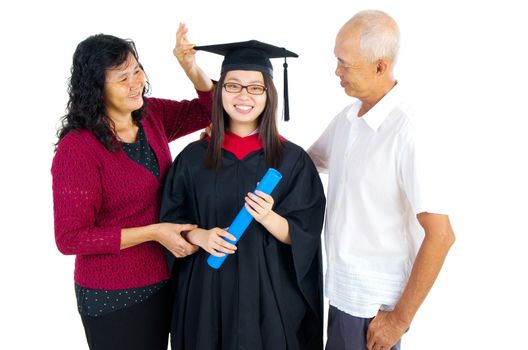 Asian university student and family celebrating graduation