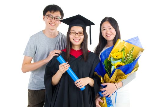 Asian university student and family celebrating graduation