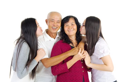 Asian parent and their daughters indoor portrait