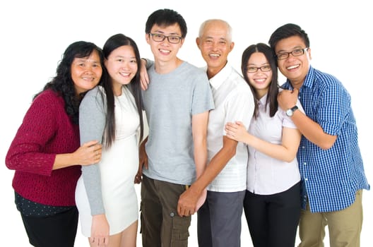 Indoor portrait of beautiful asian family over white background