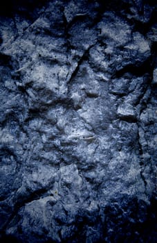 Vignetted stone wall background with lots of texture