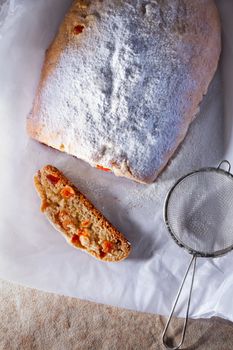 Slice of Traditional Christmas Stollen on a table