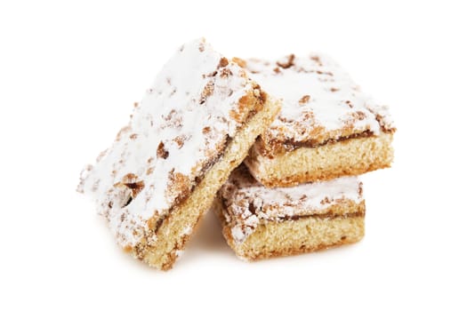 biscuit cake decorated with powdered sugar, castor sugar isolated on white background