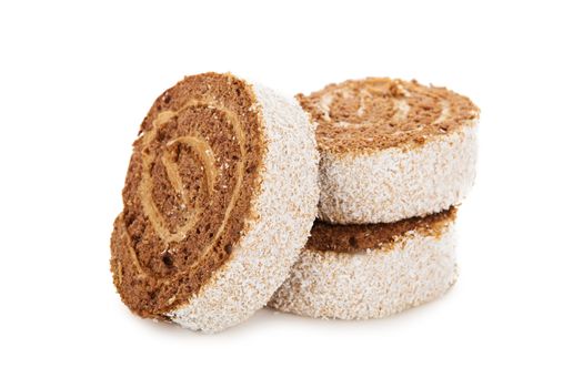 Slices of sweet roll cake decorated with Coconut chips isolated on white background