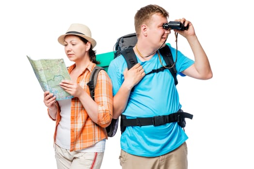 Horizontal portrait of tourists with map and binoculars, behind backpacks on white background