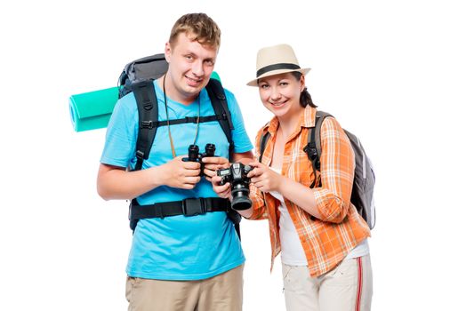 Cute young travelers with backpacks in studio