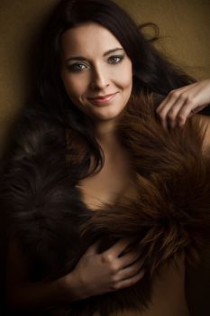 smile attractive glamor girl with brown boa