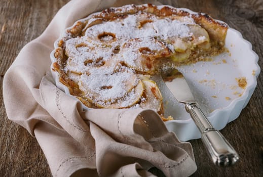 Apple Pie with Cinnamon on wooden table