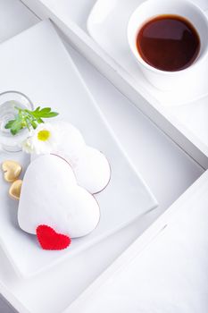 Valentine's Cookies and coffee on a white plate