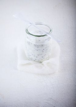 Home made Yogurt with chia seeds ona white surface