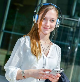 Happy Businesswoman Listening Music before a job interview