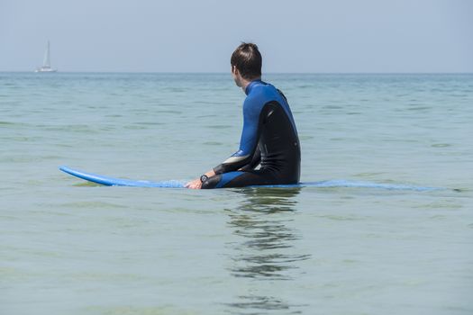 Young boy surfing in the sea