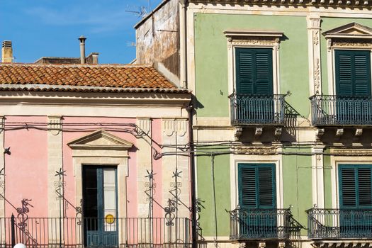 green door of an old Sicilian pink house