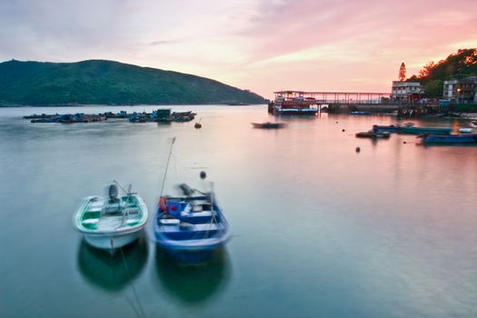 Sunset with boats and ship port