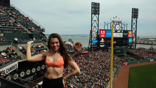 Alicia Arden the "Hoarding: Buried Alive" actress spends Easter-Eve at AT&T Park for the Giants/Rockies Game wearing an orange bikini with the price tage still attched, AT&T Park, San Francisco, CA 04-15-17