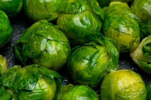 Many cooked Brussells sprouts close up background