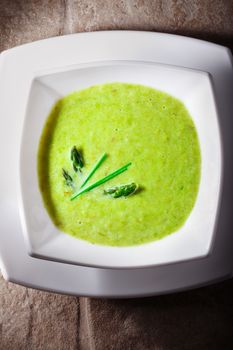 Closeup of a bowl of healthy vegetarian asparagus soup.
