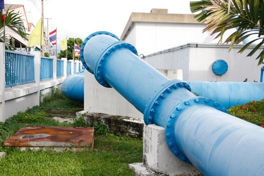 big blue Steel pipes and couplings of an irrigation water