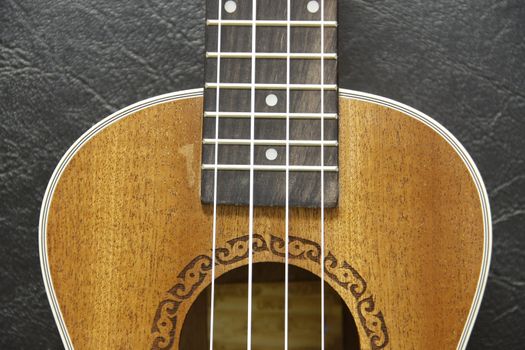 part and texture of brown wood ukulele