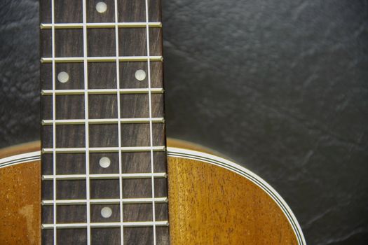 part and texture of brown wood ukulele