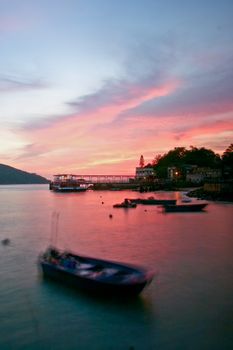 Sunset with boats and ship port