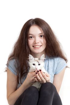 the young beautiful girl and her cat on a white background