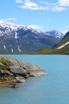 Mountain landscape with glacial river in Jostedalsbreen National Park, Briksdalen valley, Norway 