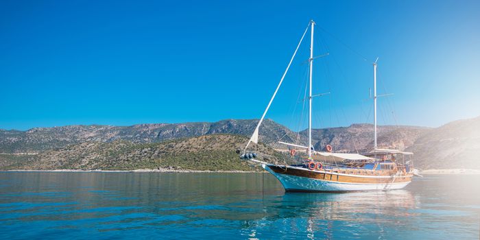 yacht on bay and castle in Kekova, near ruins of the ancient city on the Kekova island, Turkey