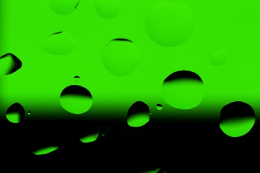 Abstract Background with Oil Drops on Black - Green