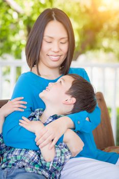 Outdoor Portrait of Chinese Mother with Her Mixed Race Chinese and Caucasian Young Boy