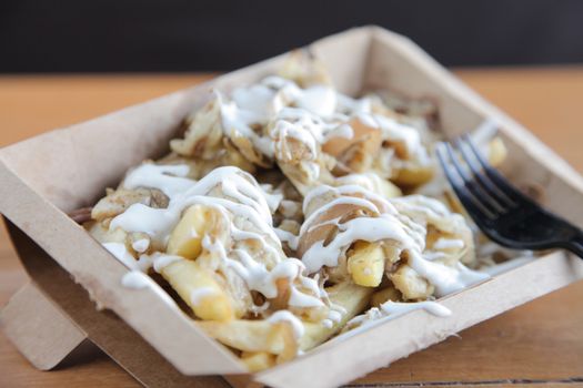 Poutine fries with meat and cheese

