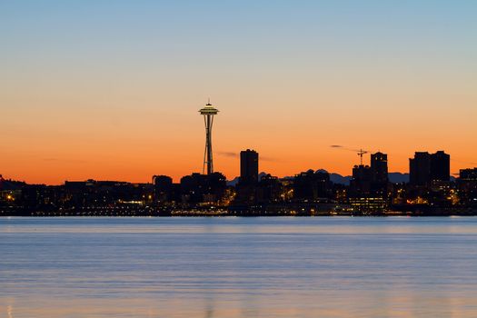 Seattle Washington city skyline silhouette during orange glow sunrise