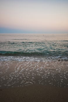Blue sea with waves in the evening