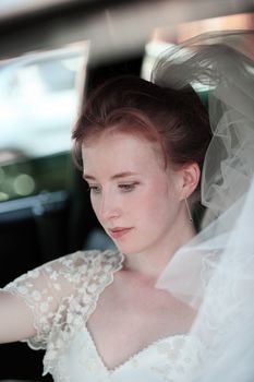 Beautiful the bride in car