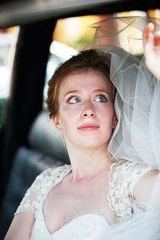 Beautiful the bride in car