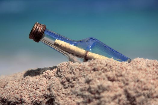 Message in the bottle on sand beach