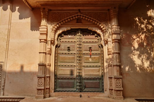 Wooden gate of an ancient temple in Vrindavan, India