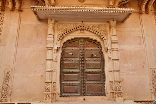 Wooden gate of an ancient temple in Vrindavan, India