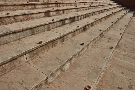 Clay plates arranged on the stairs for diwali celebration in India