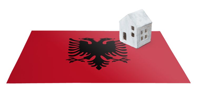 Small house on a flag - Living or migrating to Albania