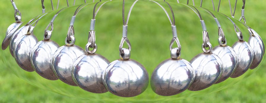 Newton's Cradle or pendulum ball, Newton pendulum also called Newton's cradle.
Physics is action, reaction and concept or cause and effect.