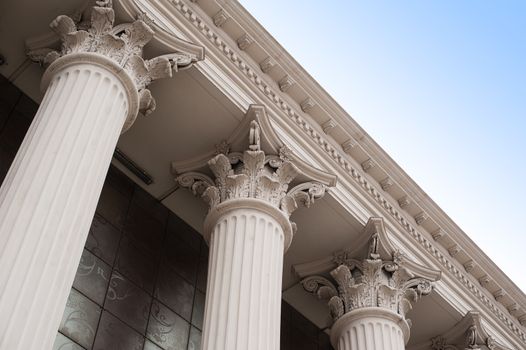 Beautiful columns of the capital on the facade of the historic building.