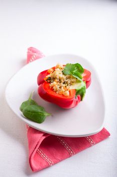 Stuffed red peppers filled with quinoa and vegetables