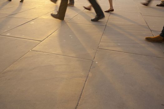 Low angle view of commuters legs at rush hour